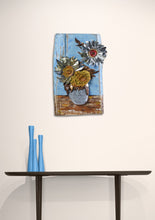 Load image into Gallery viewer, Sunflowers III by Scoobafish displayed in a contemporary interior, showing the recycled-metal sunflower sculpture mounted above a console table.