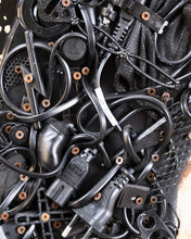 Load image into Gallery viewer, Close-up of Judith’s hair by Scoobafish, constructed from tangled black cables, plugs, electronic parts and exposed screws.