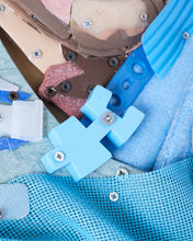 Load image into Gallery viewer, Work in progress detail showing plastic color selection process for El Pibe de Oro sculpture