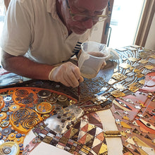 Load image into Gallery viewer, Scoobafish artist working on Woman in Gold in studio, creative process
