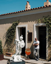 Load image into Gallery viewer, Artist Scoobafish standing beside Plastic Apocalypse – Trojan Warrior outside his studio in Sardinia, showing the sculpture’s scale.
