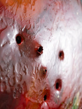 Load image into Gallery viewer, Close-up of the metal bullet holes from Tomatinho recycled traffic sign sculpture by Scoobafish.
