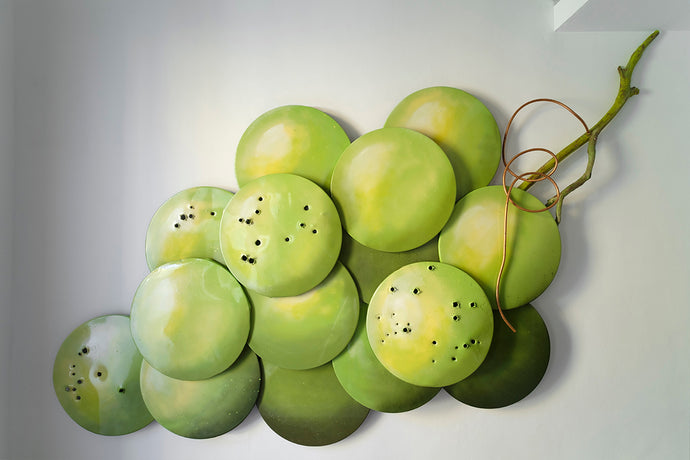 Giant grape bunch front view large scale recycled sculpture sustainable art