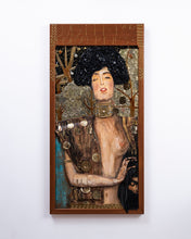 Load image into Gallery viewer, Judith by Scoobafish displayed on a white wall, showing the complete artwork within its handcrafted wooden frame.
