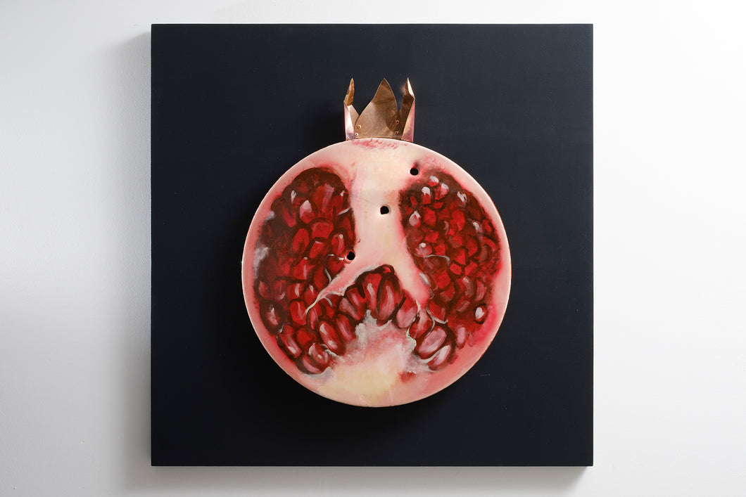 Pomegranate slice front view recycled metal sculpture sustainable art