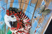 Load image into Gallery viewer, Close-up of Proud Parrot’s head by Scoobafish, showing the white beak, mechanical eye and layered red metal feathers on painted wood.
