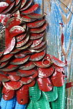 Load image into Gallery viewer, Close-up of Proud Parrot’s layered red plumage by Scoobafish, showing painted reclaimed metal elements and an aluminium can pull tab.
