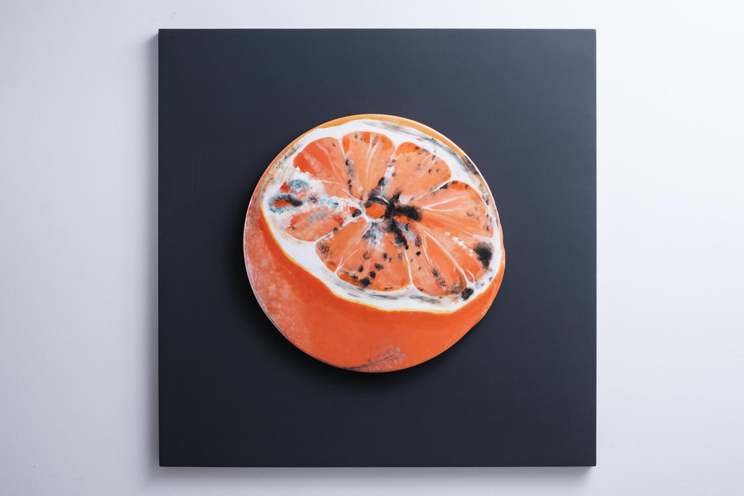 Yummy orange slice front view recycled metal sculpture sustainable art